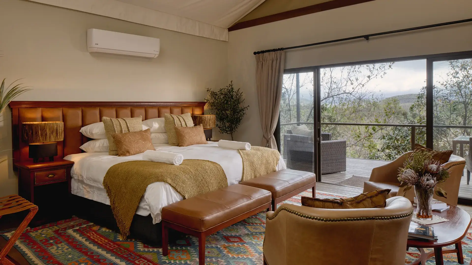 Impala tent bedroom with king bed and veranda view