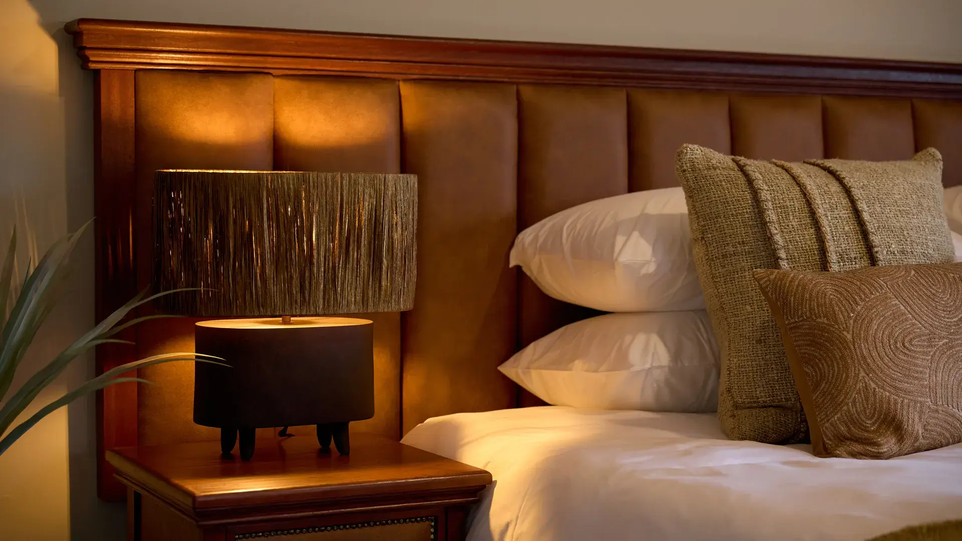 Bedside lamp and leather headboard detail