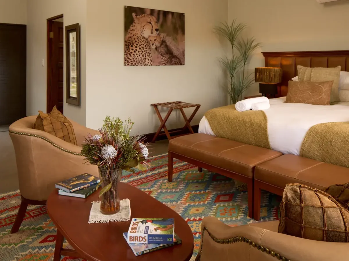 Lounge area and bed in an Impala tent